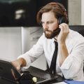 Business professionals reviewing digital document management solutions